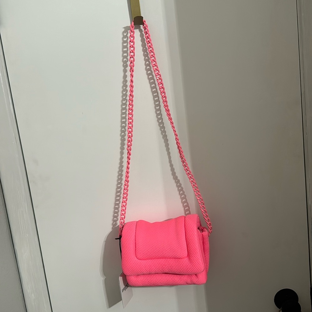 Pink designer purse NWT and dust bag.